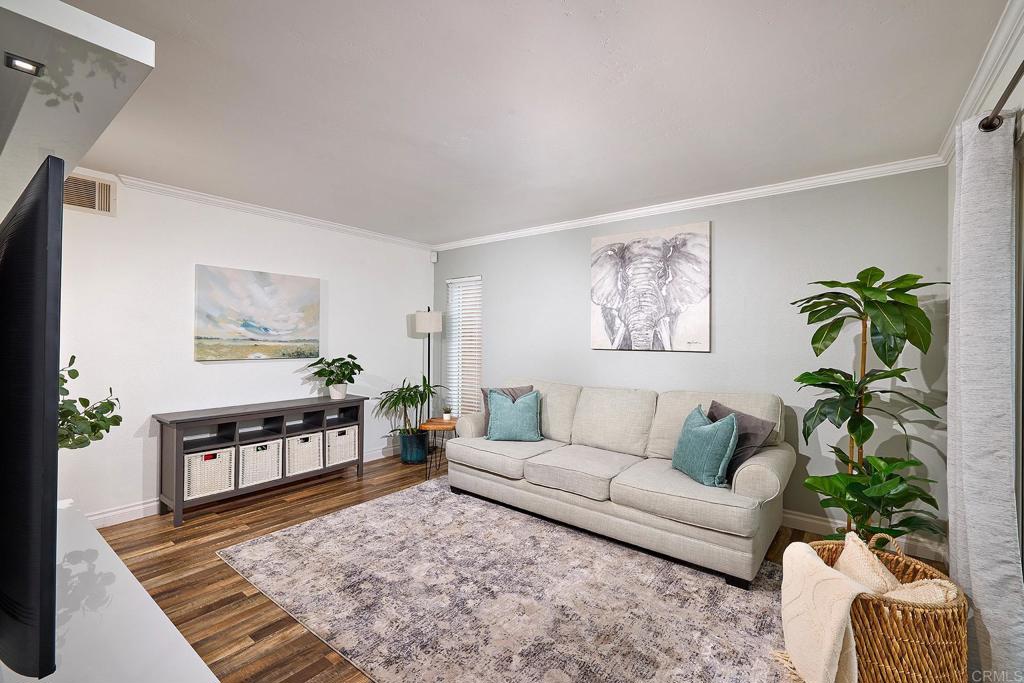 a living room with furniture rug and window