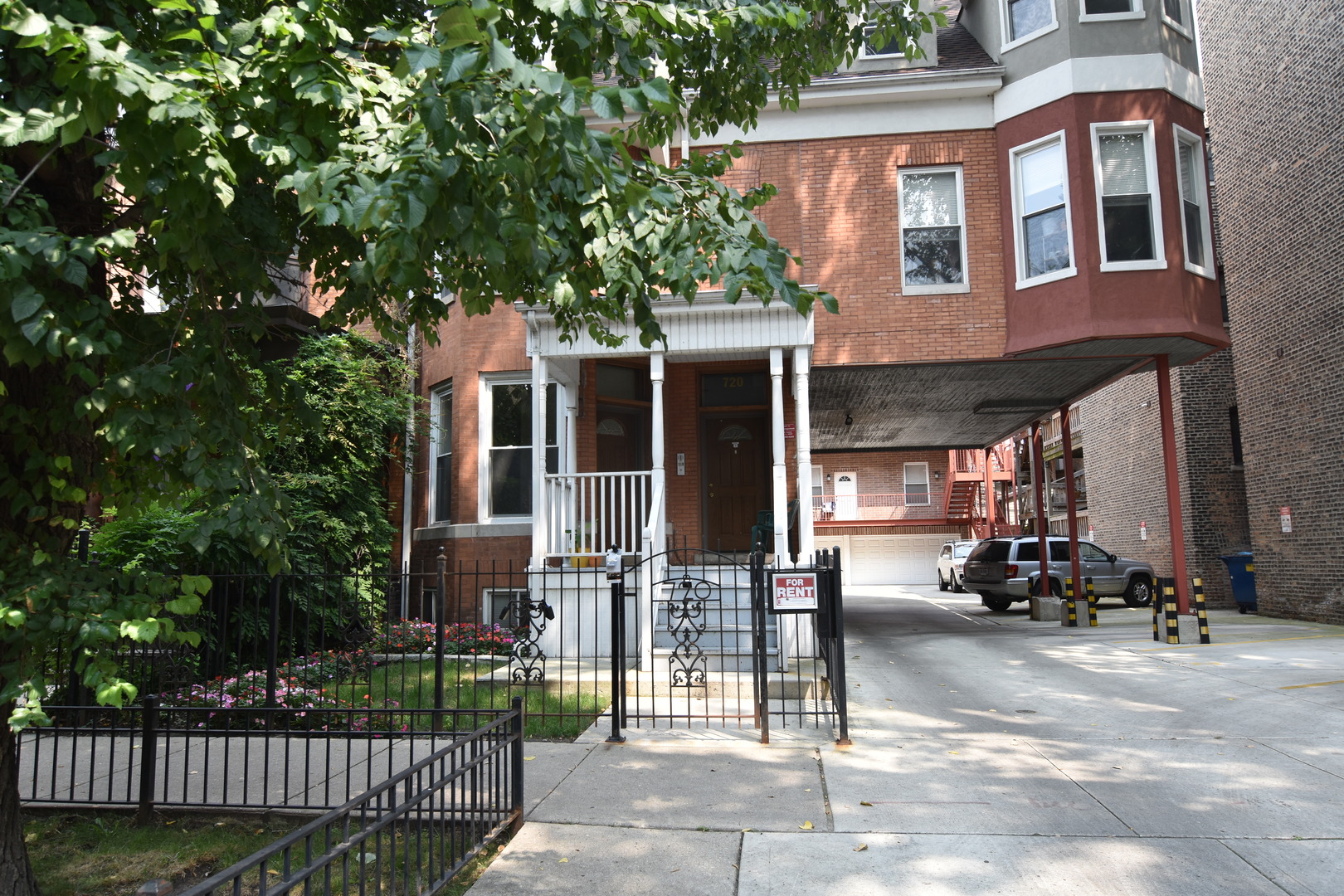 a view of a brick house with many windows