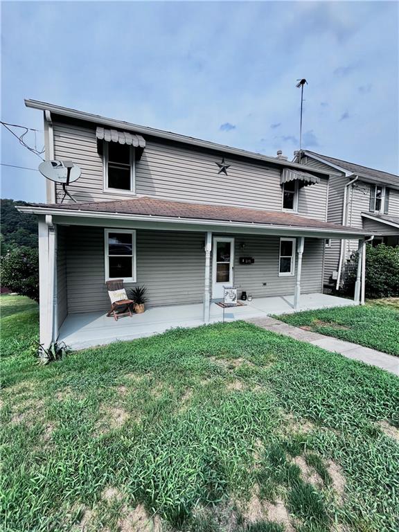 a front view of a house with a yard