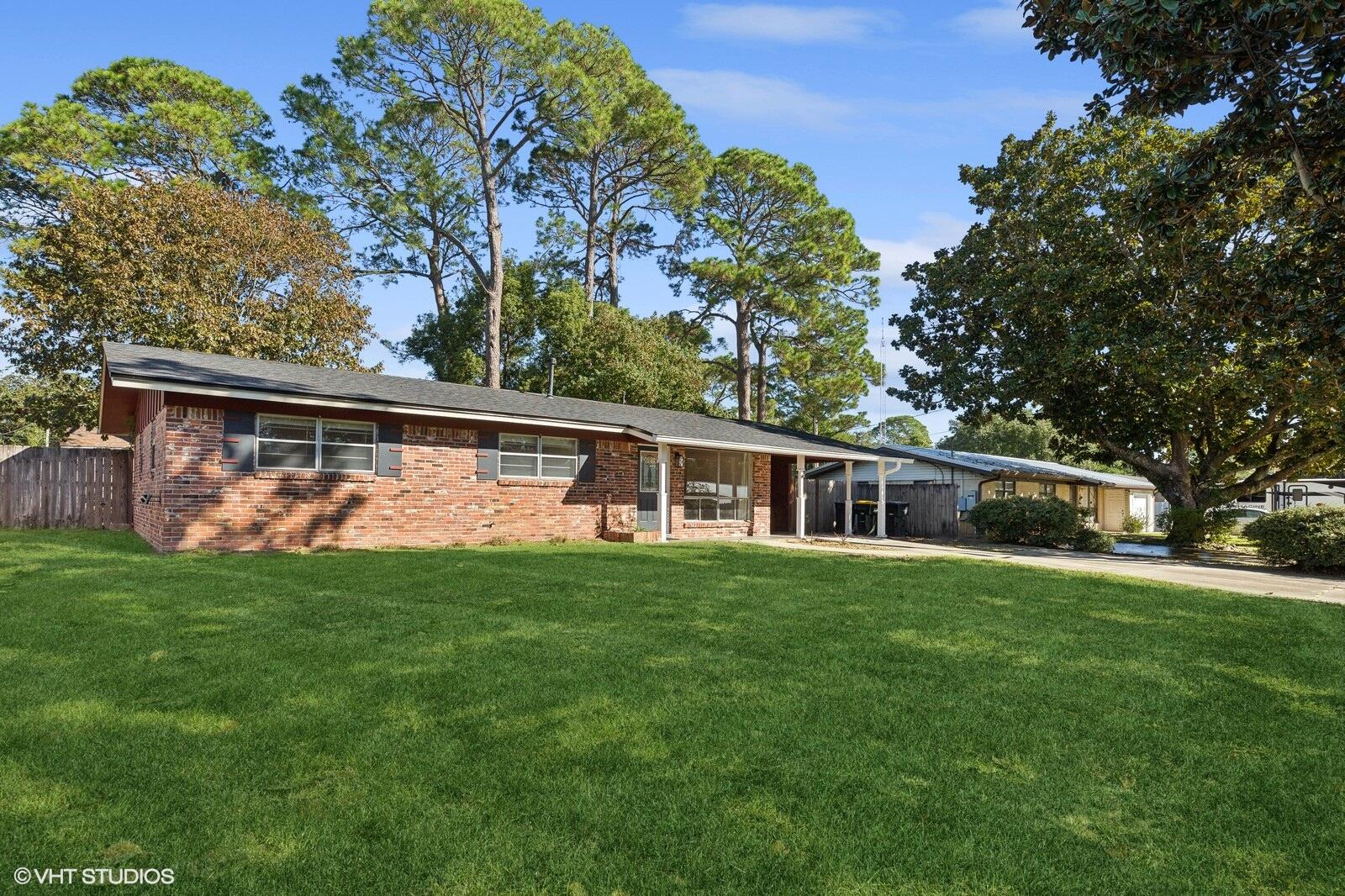 front view of a house with a yard