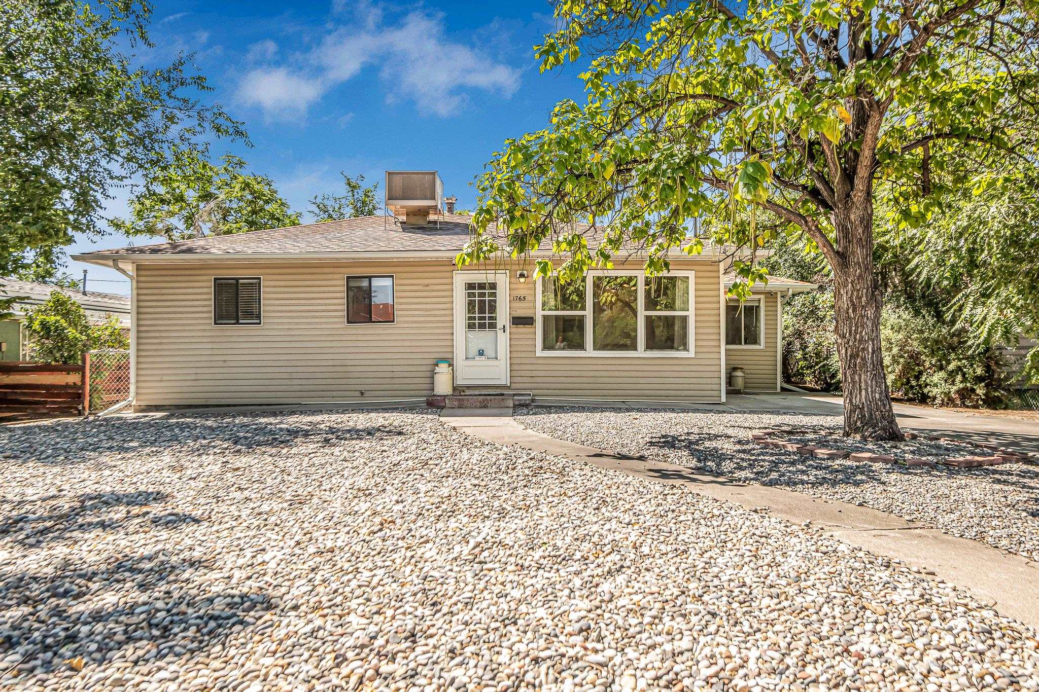 front view of a house with a trees