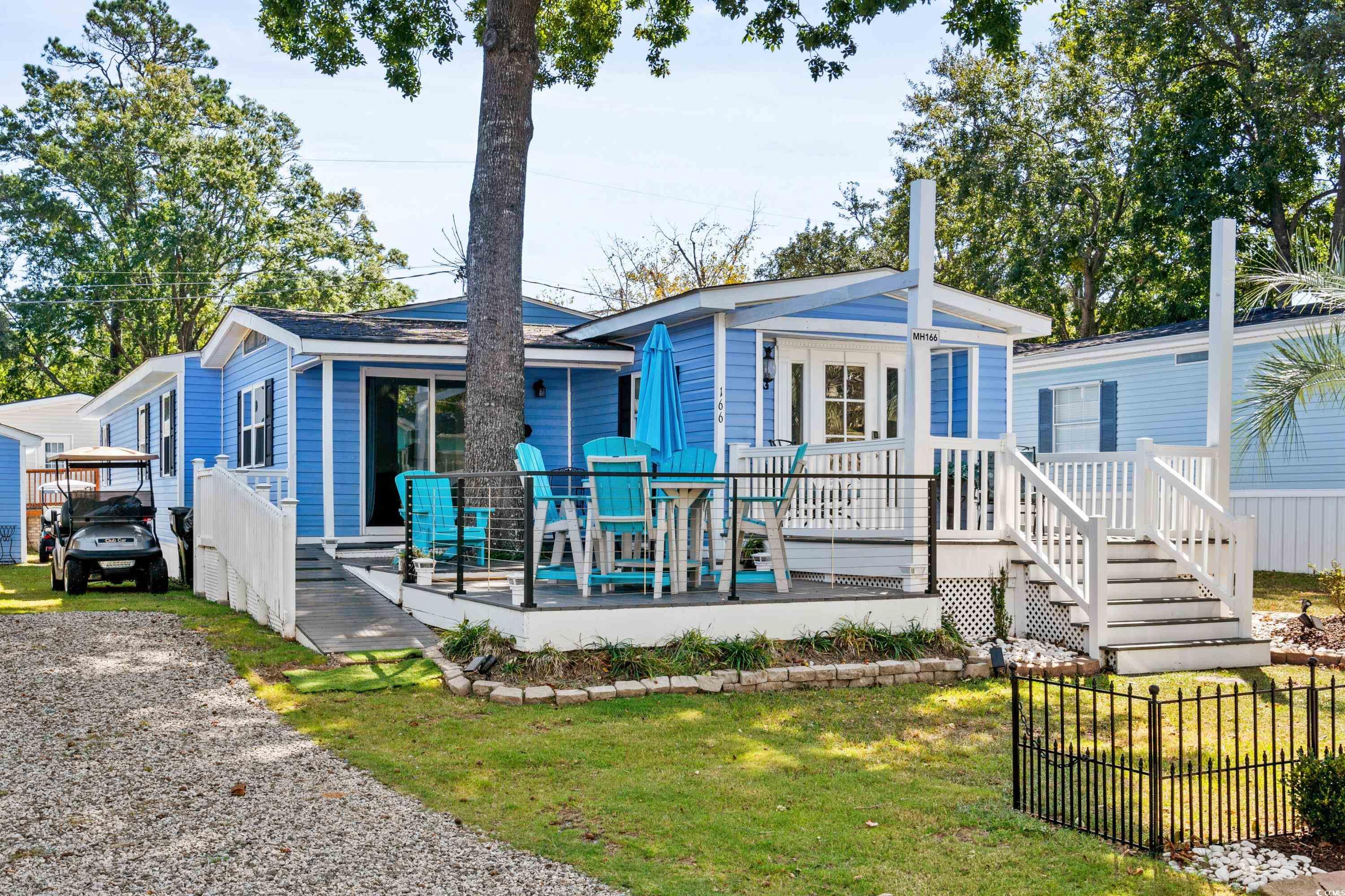 View of front of property with a front lawn and a