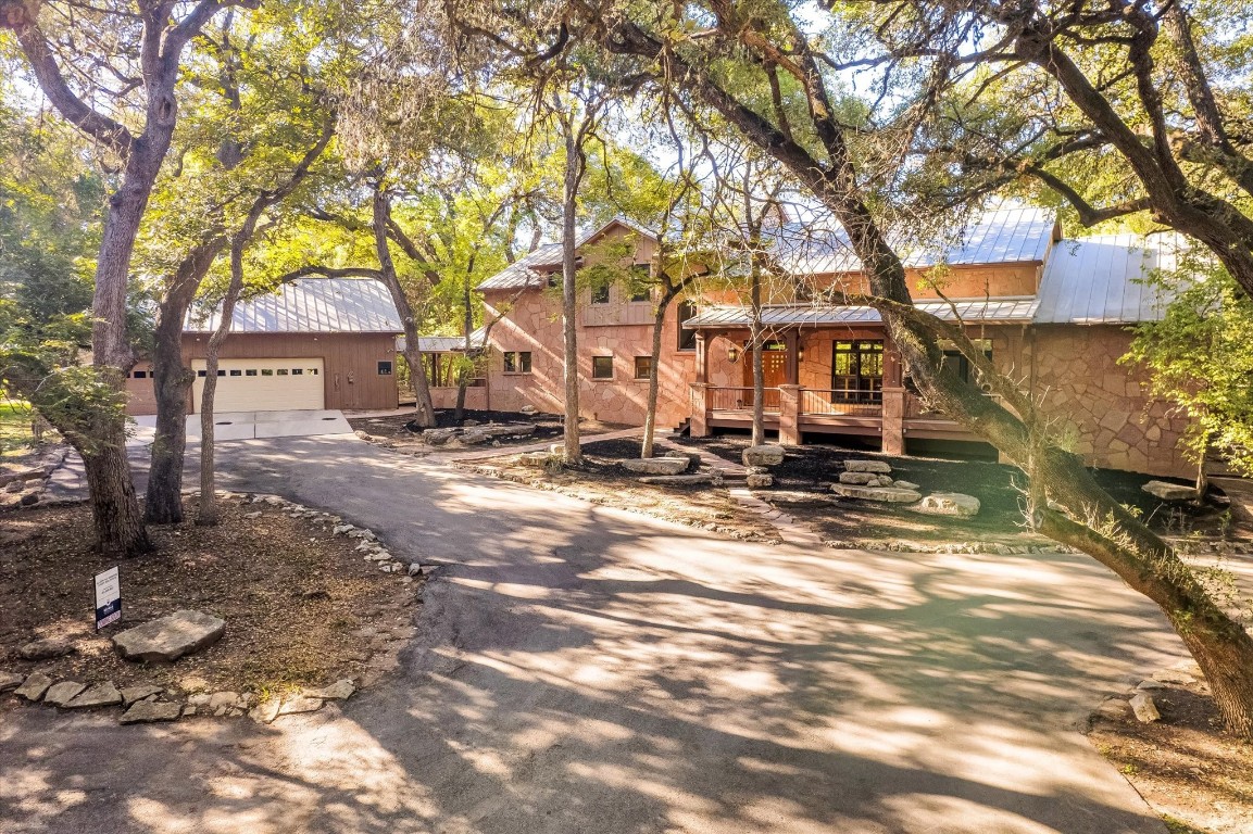 a view of a large trees in front of a house