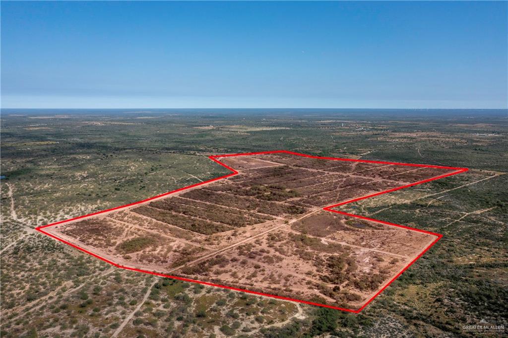 Birds eye view of property with a rural view