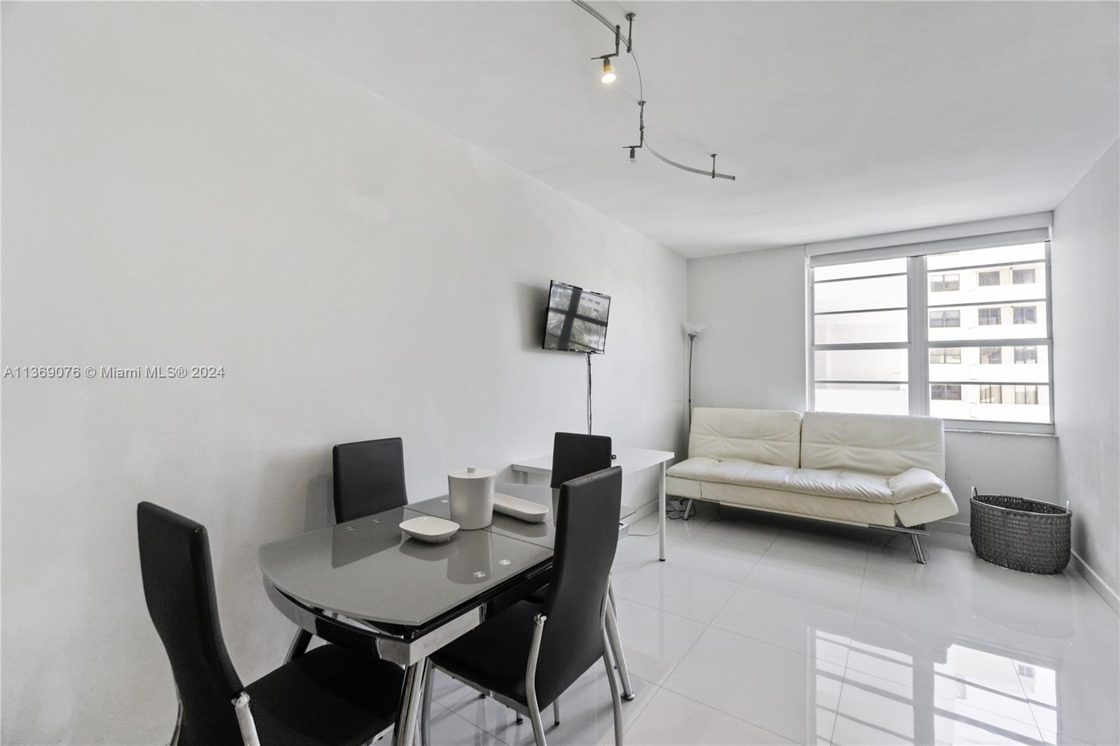 a living room with furniture and a window