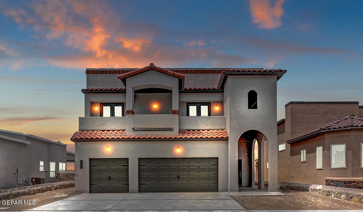 a front view of a house with a garage