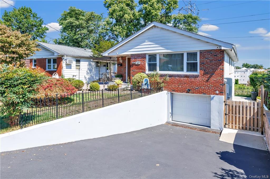 View of front of property with a garage