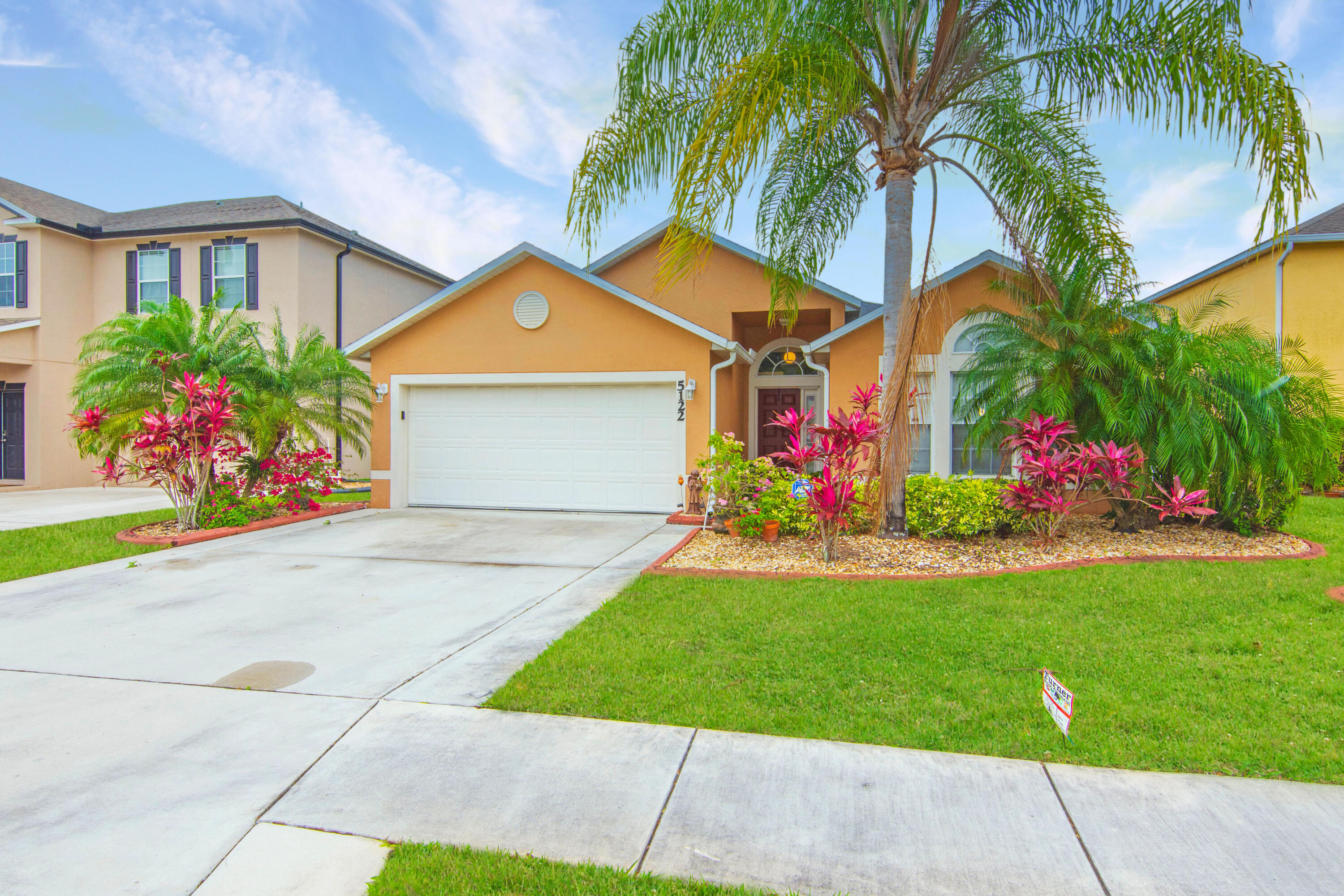 a front view of house with yard and outdoor seating