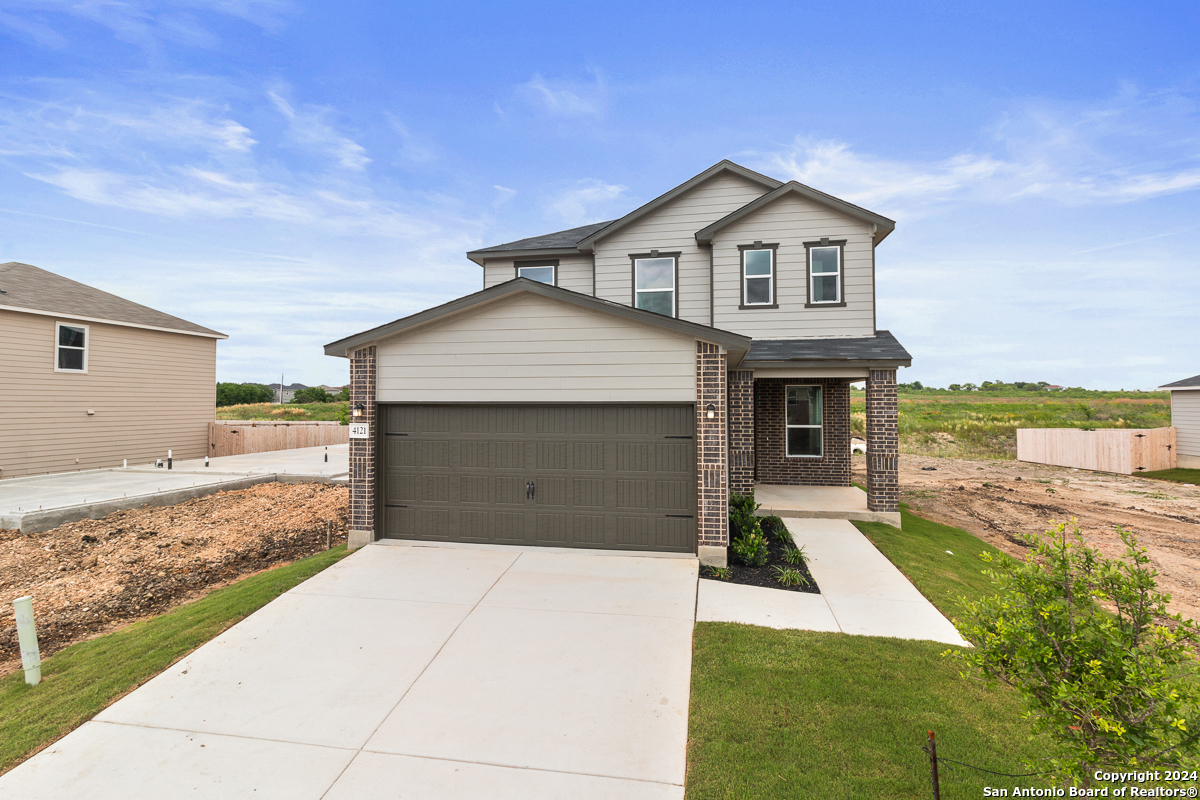 a front view of a house with yard