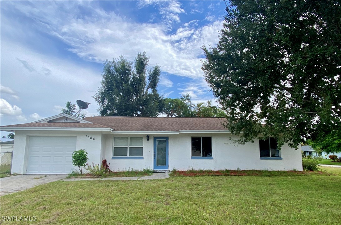 front view of a house with a yard