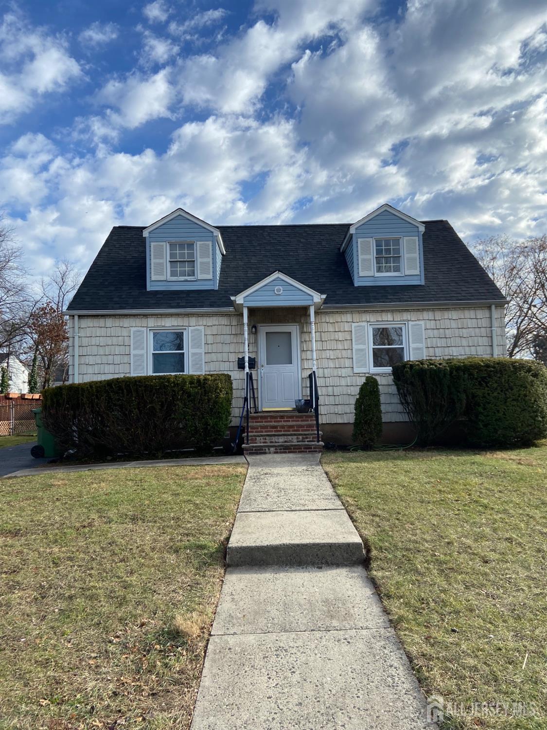 a front view of a house with yard