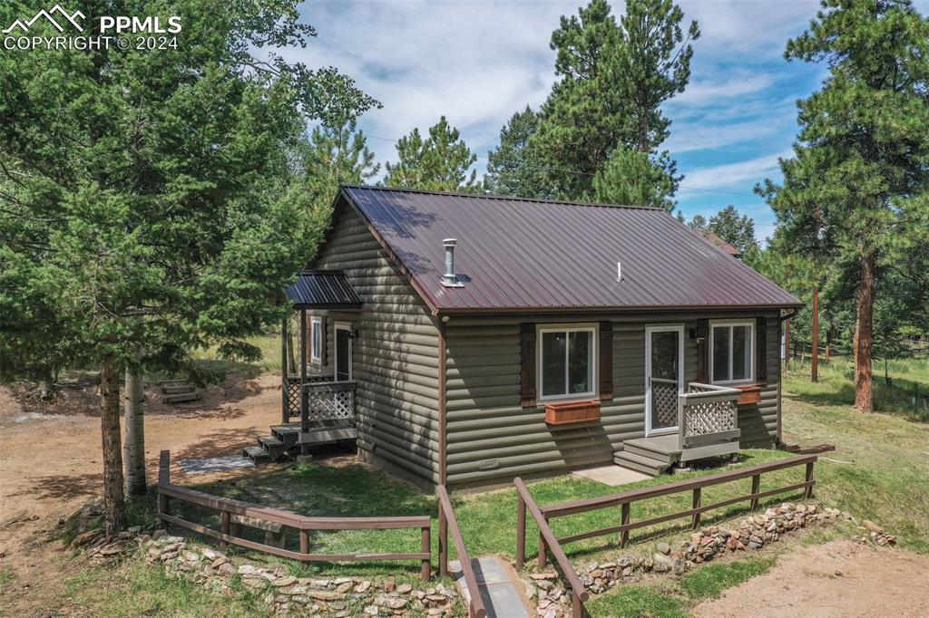 View of front of property with a front yard