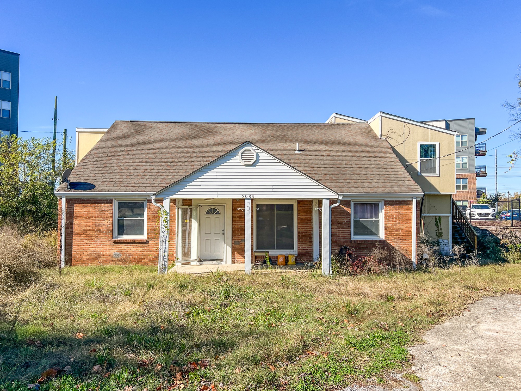 front view of a house with a yard