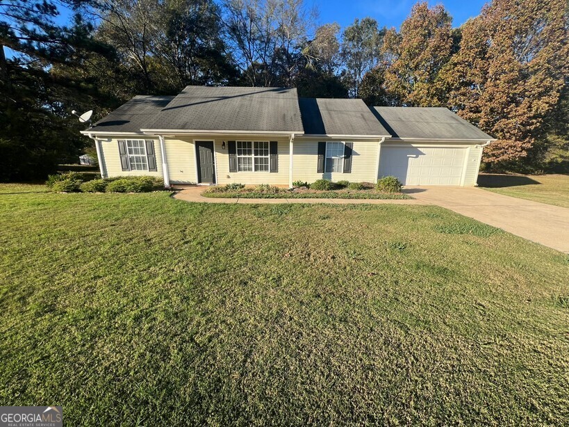 a aerial view of a house with a yard