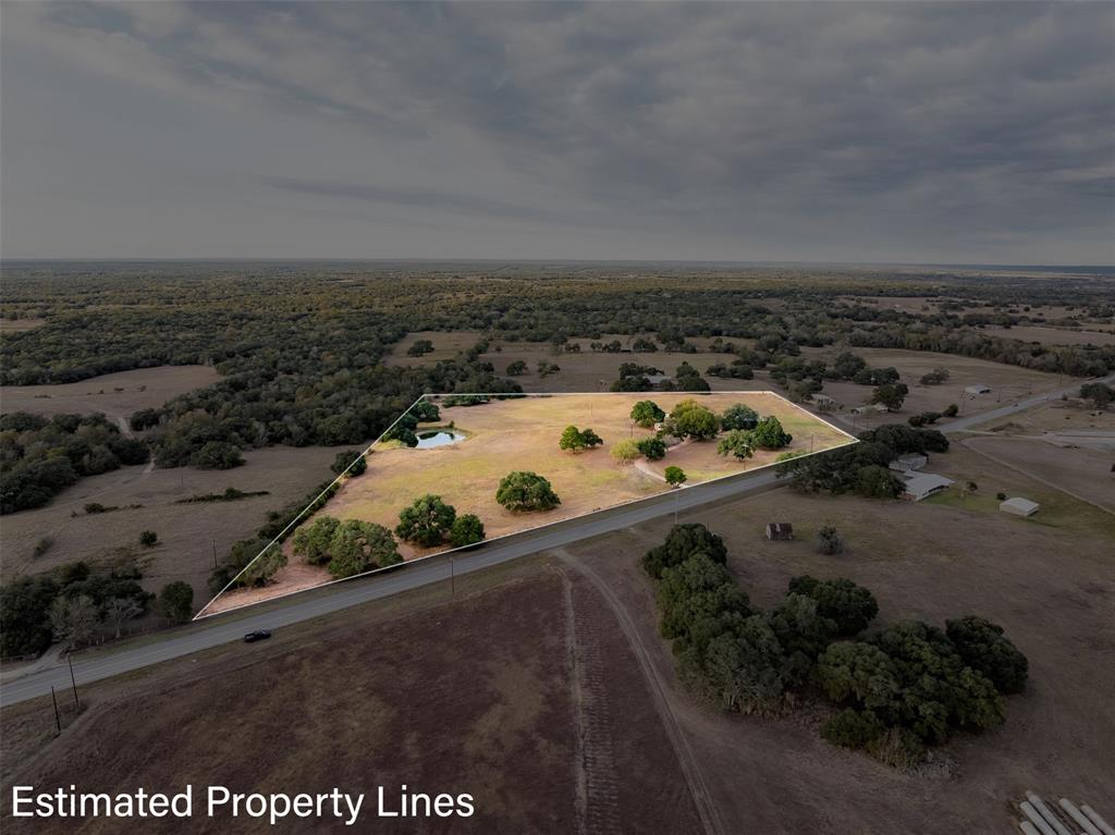 an aerial view of roof and yard