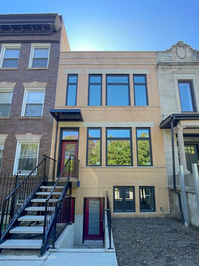 a view of a brick building with many windows