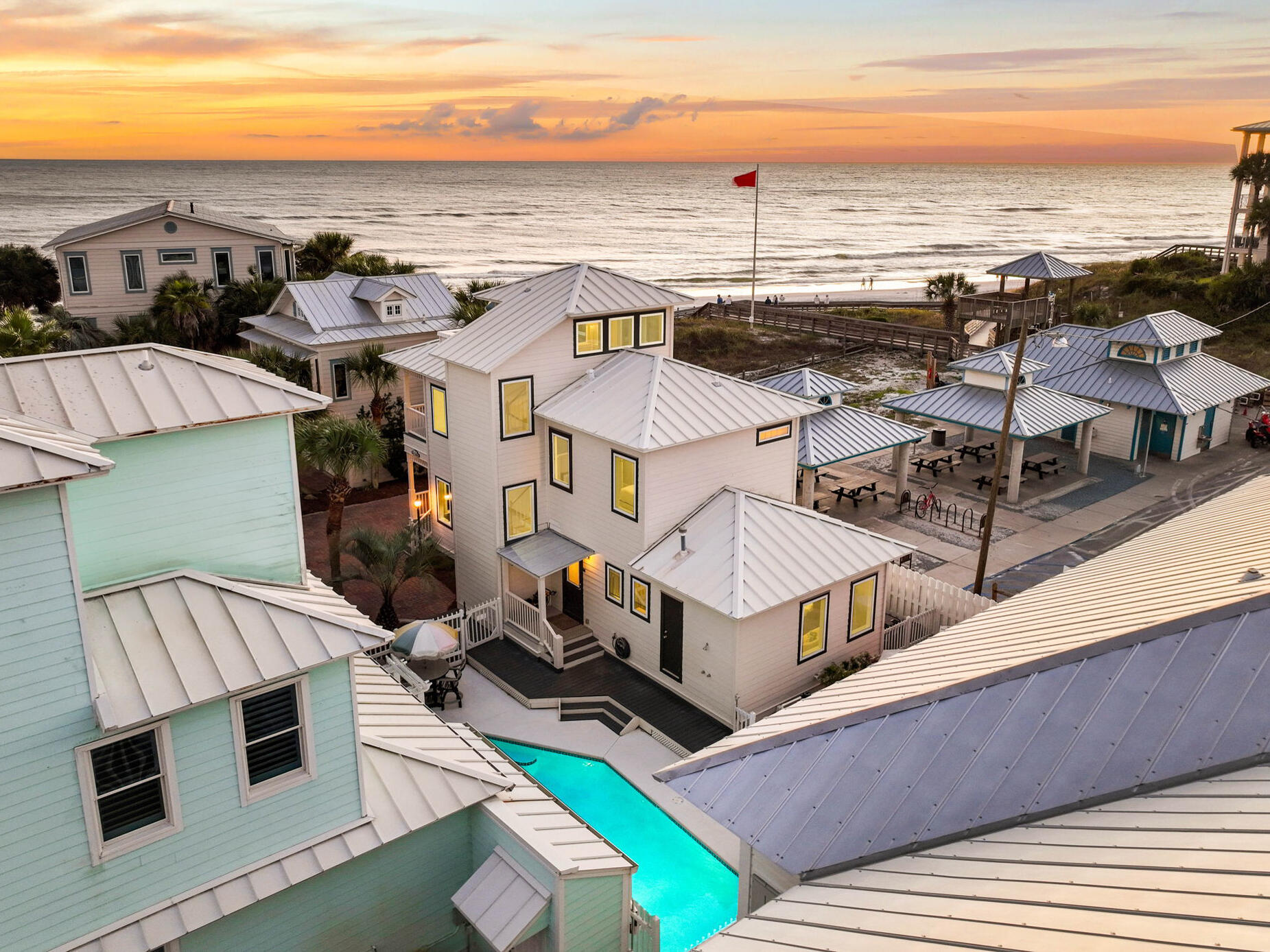 an aerial view of a house with a ocean view