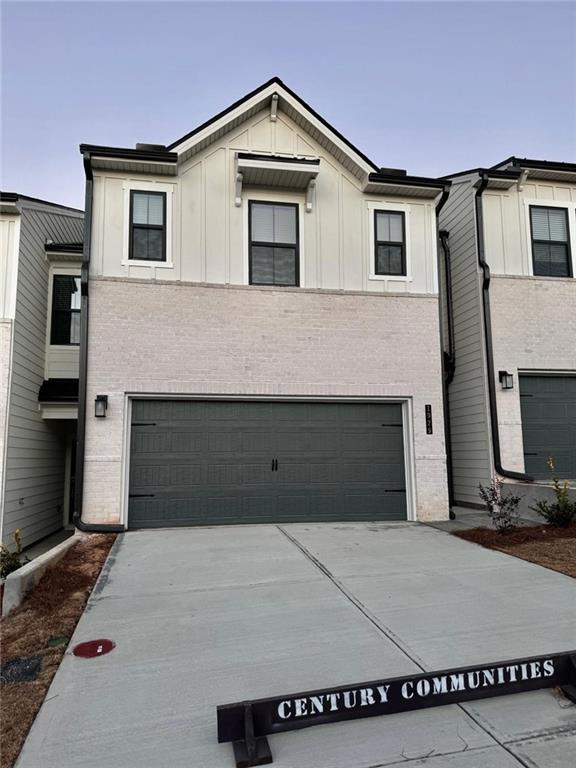 a front view of a house with garage