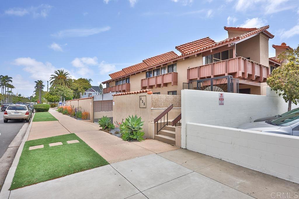 a view of a house with a swimming pool and a yard