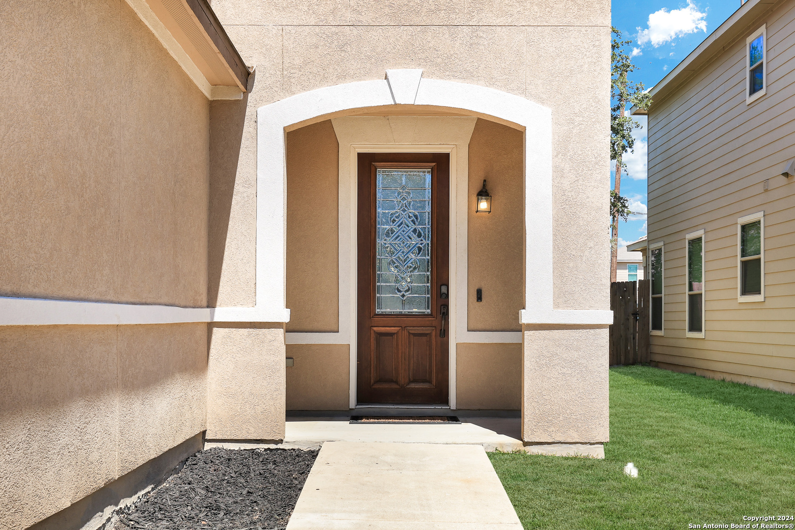 a front view of a house with a yard