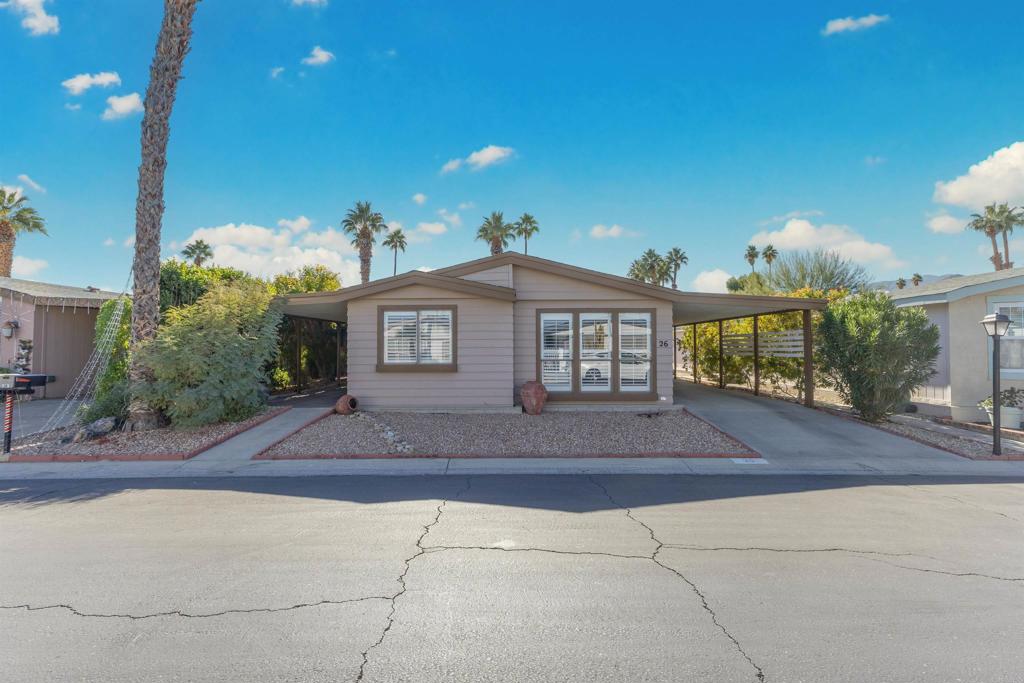 a front view of a house with yard