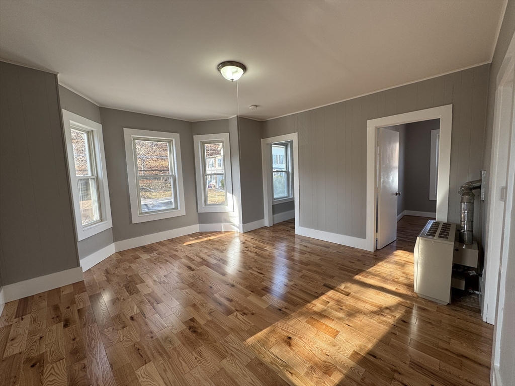 a view of livingroom with hardwood floor and hallway