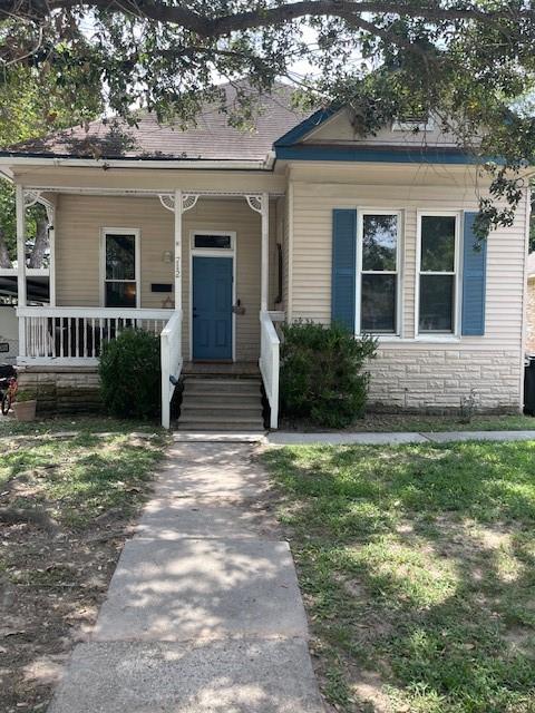 front view of a house with a yard