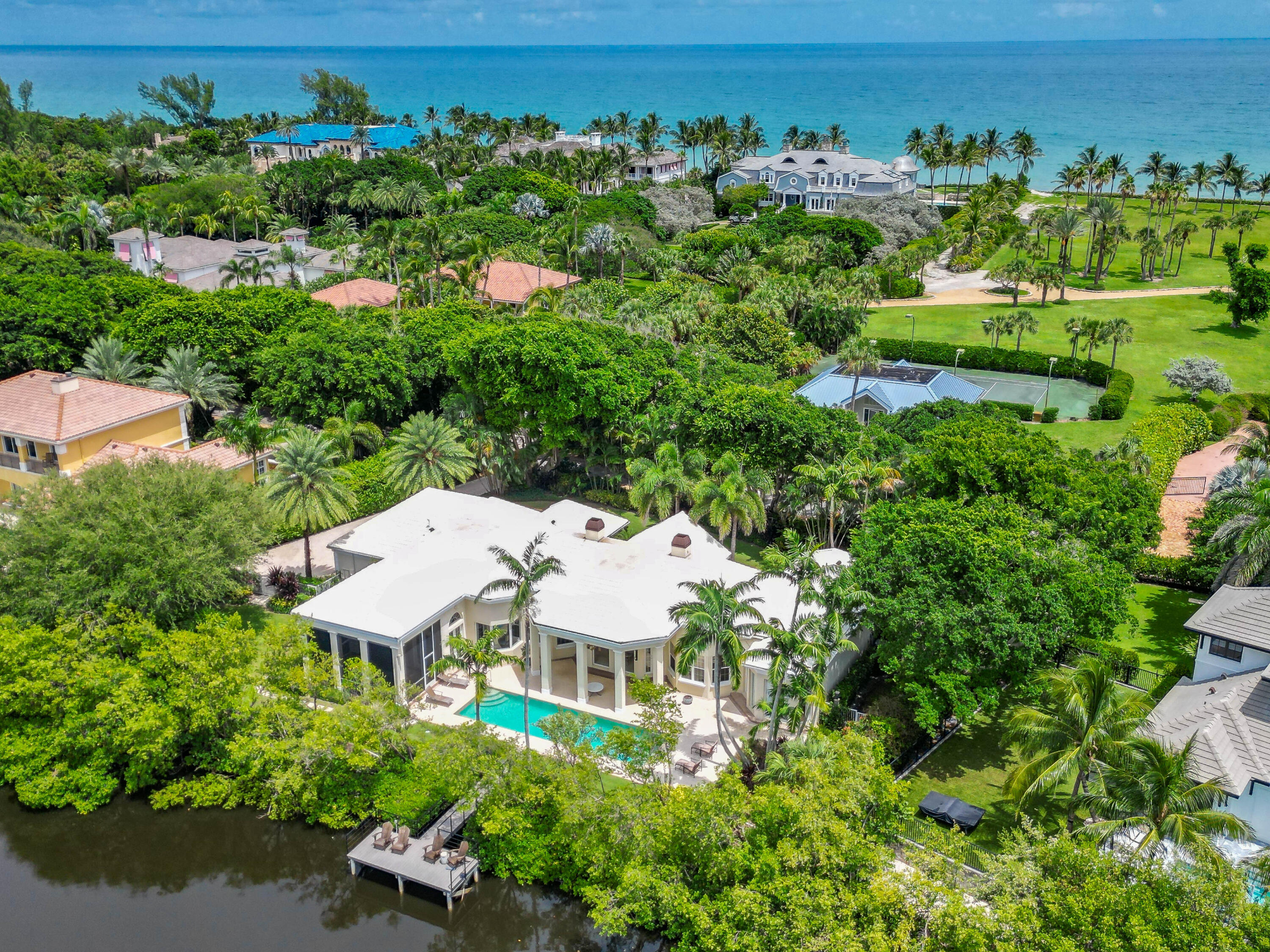 an aerial view of a house with yard swimming pool outdoor seating and yard