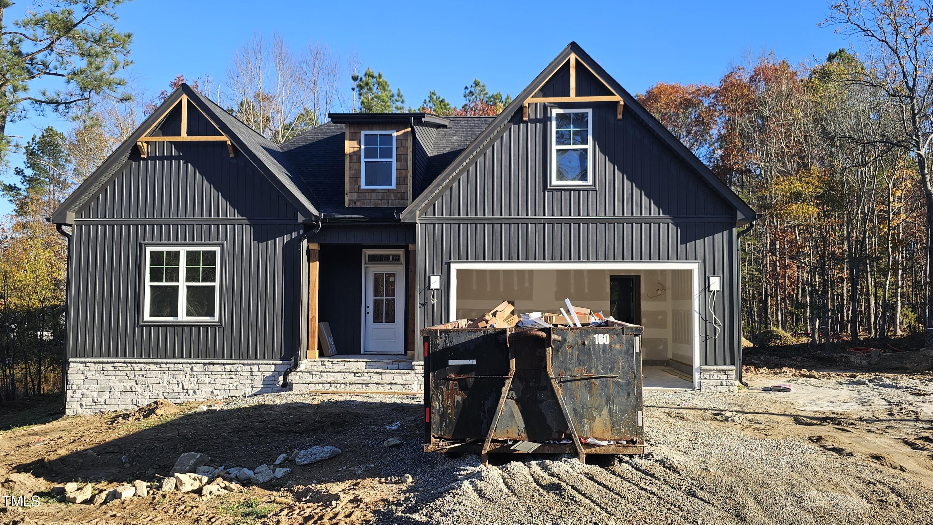 a front view of house with an outdoor space