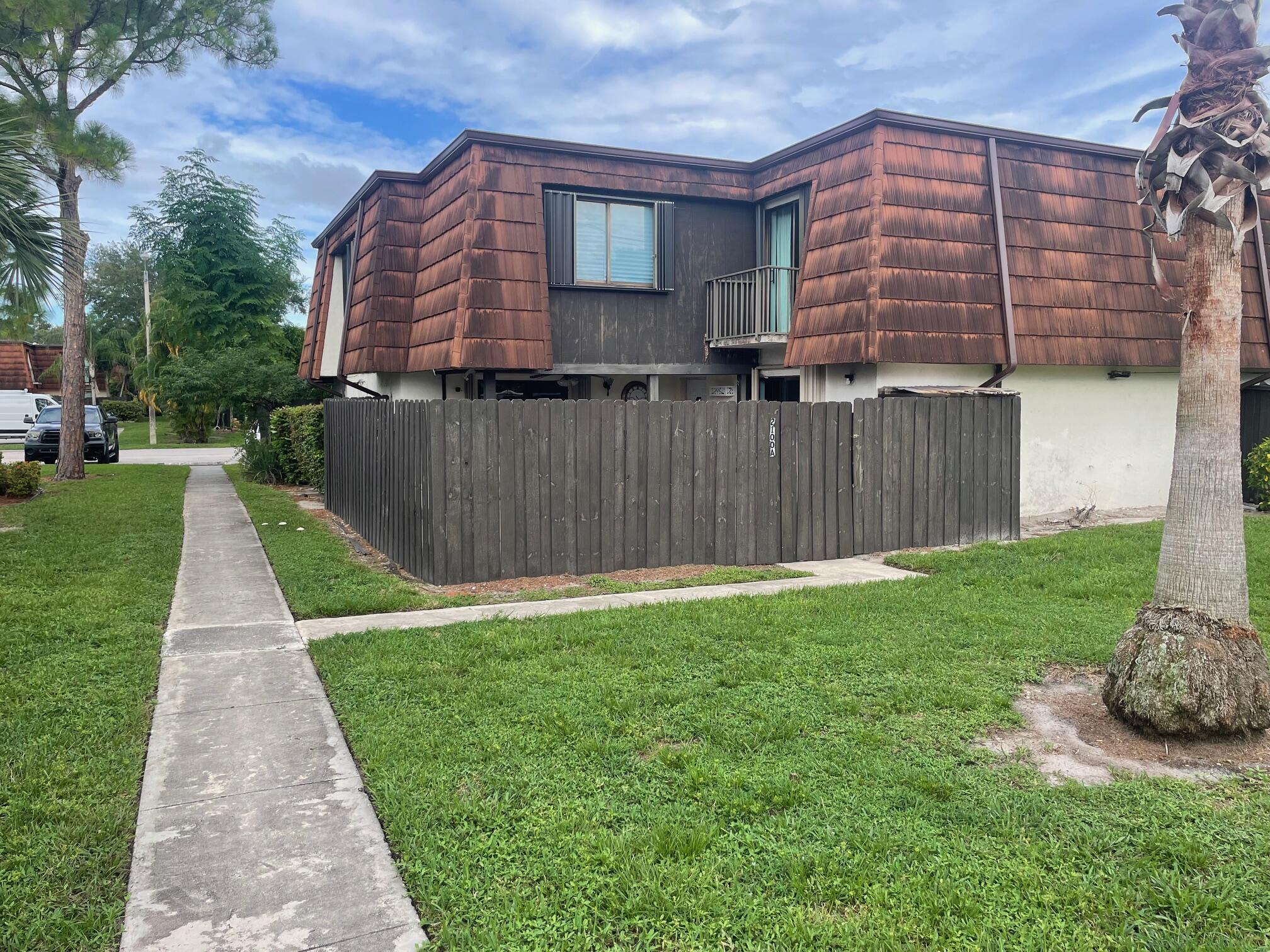 a front view of a house with yard