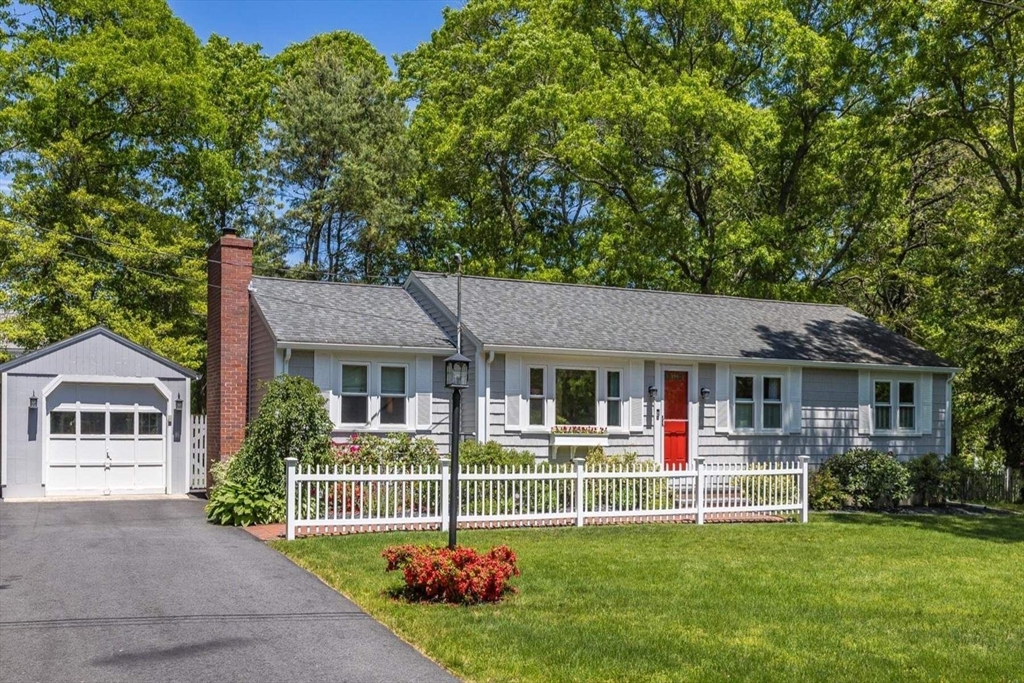 front view of a house with a yard