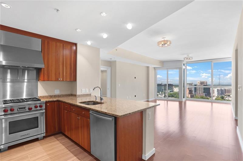 a kitchen with a stove a sink and a refrigerator