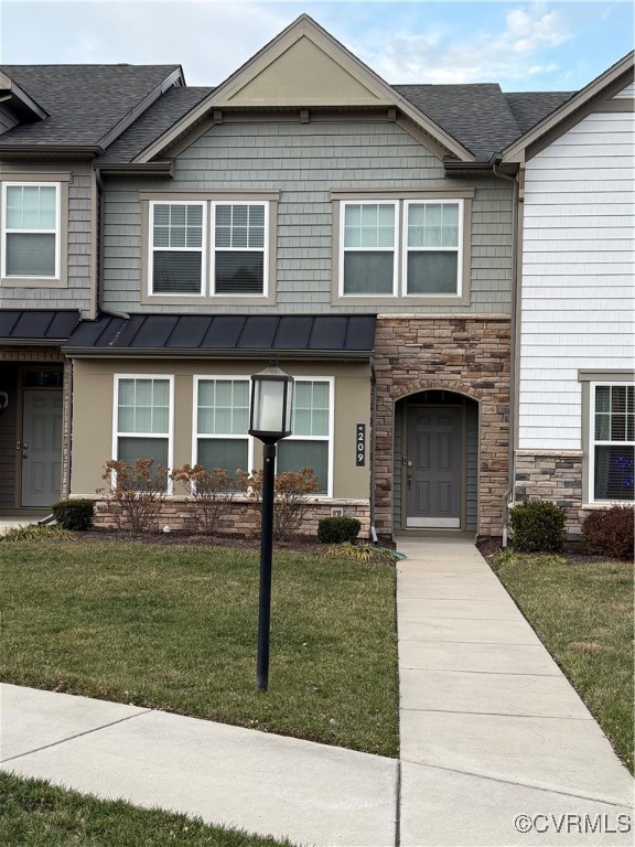 a front view of a house with a yard