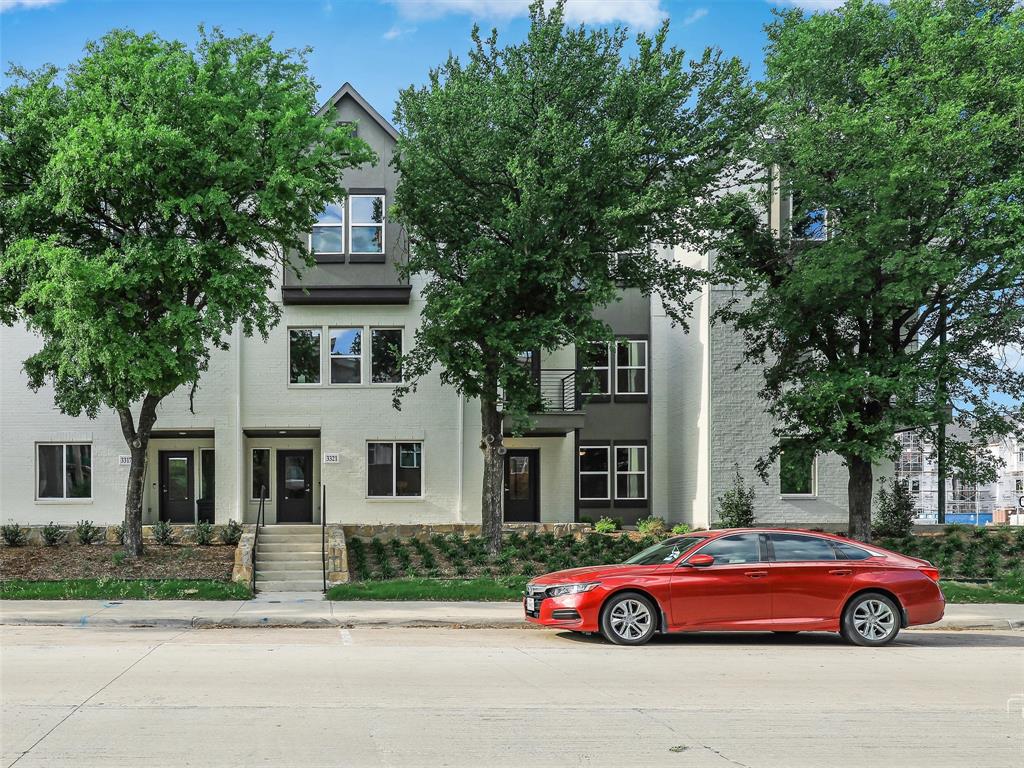 a front view of a house with parking space