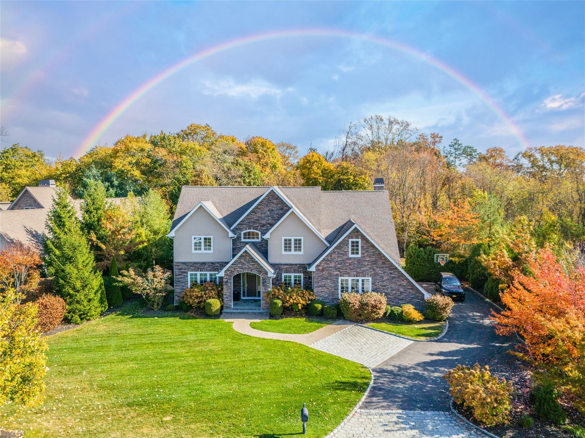 a front view of house with yard and green space