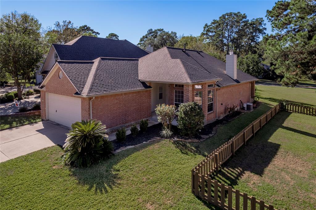 a aerial view of a house with a yard