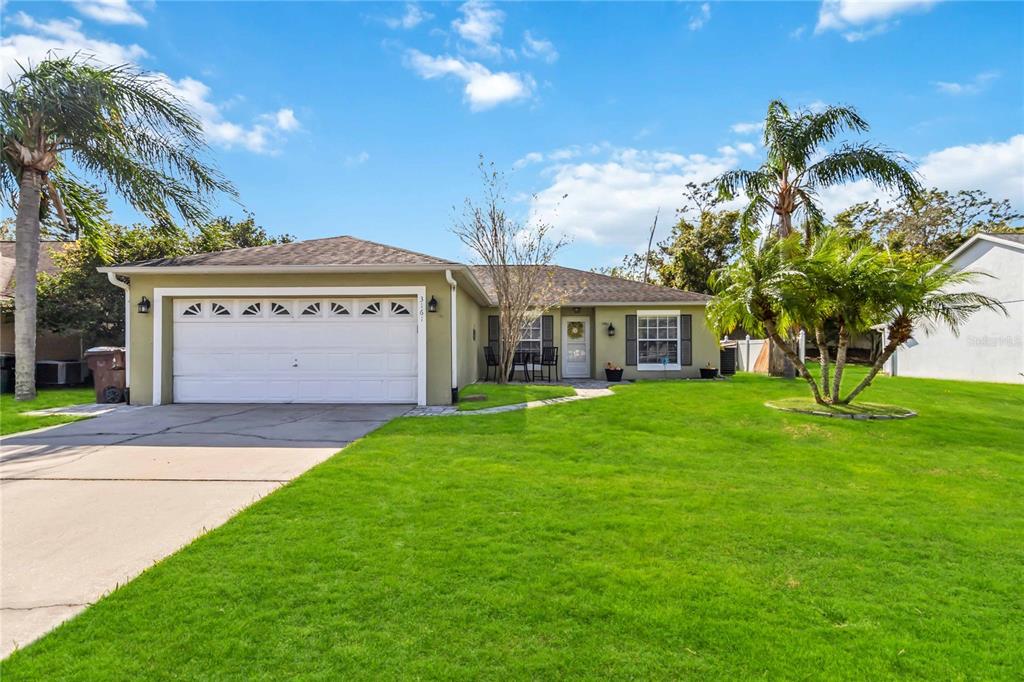 a view of a house with a yard