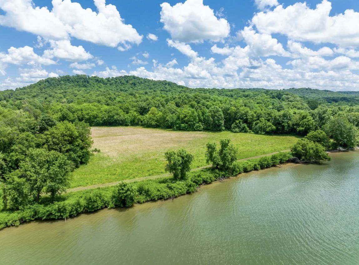 a view of a lake with a yard