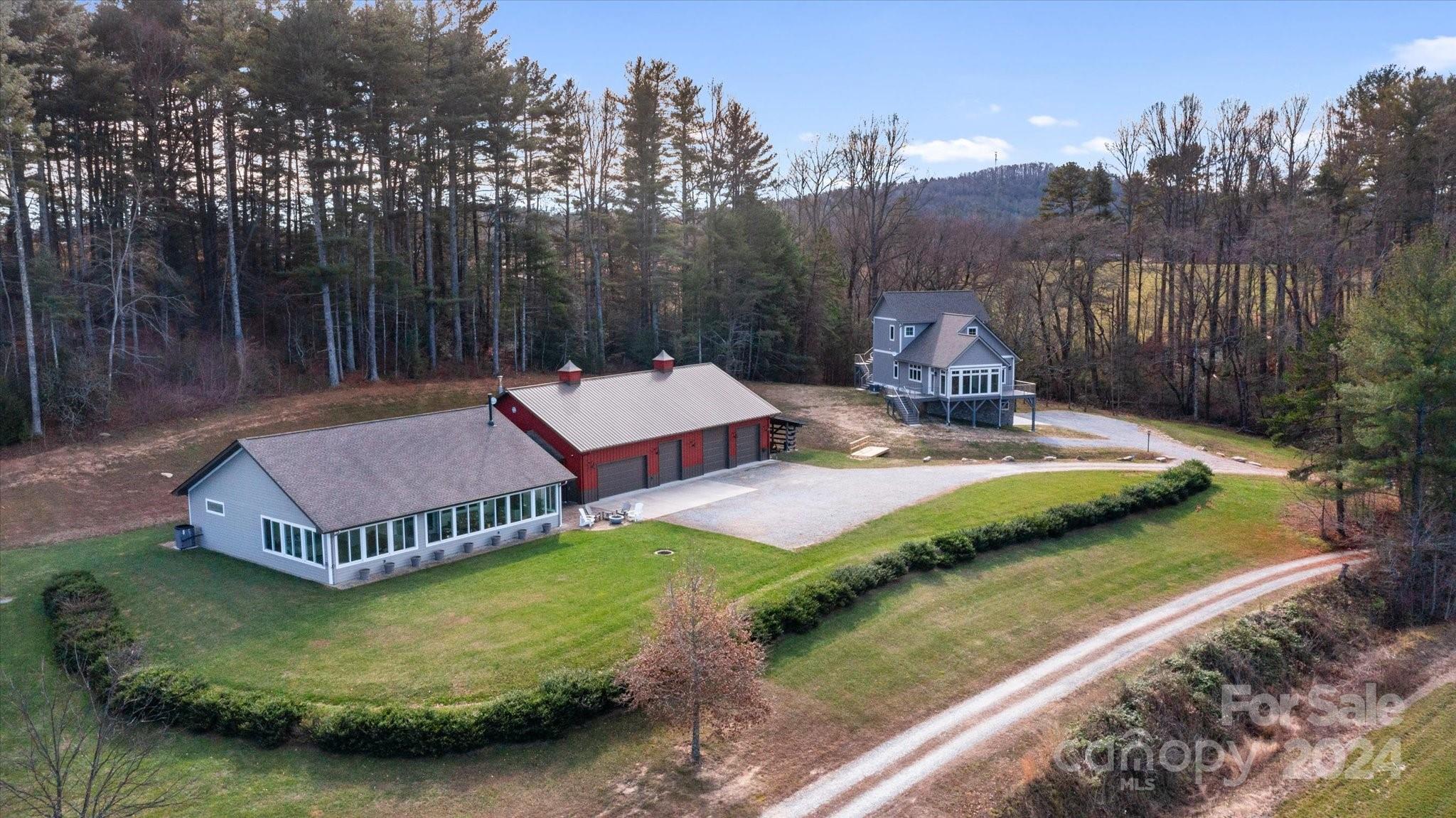 a view of a house with backyard and pool