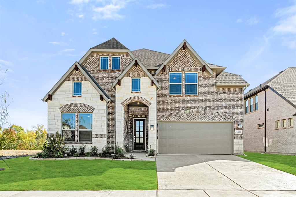 front view of a house with a yard