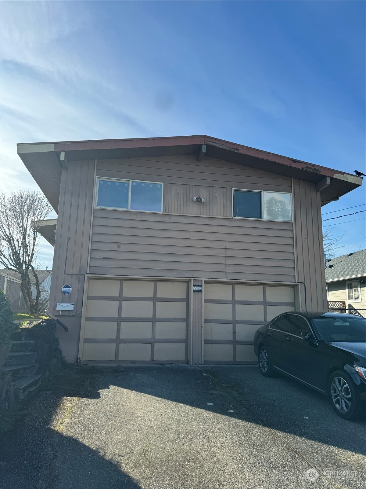 a front view of a house with a garage