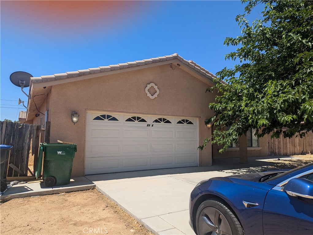 a front view of a house with parking space