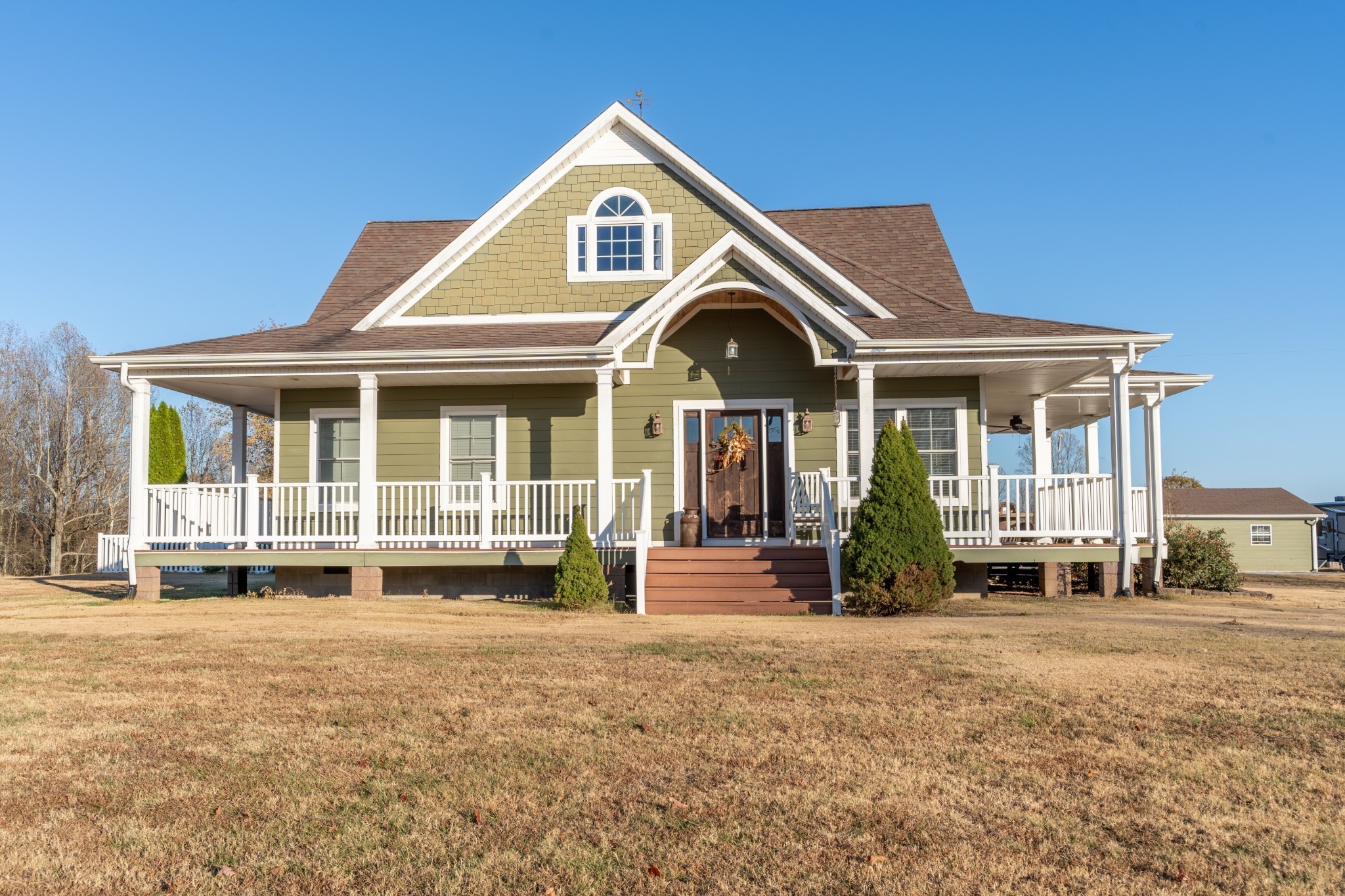 a front view of a house with a yard