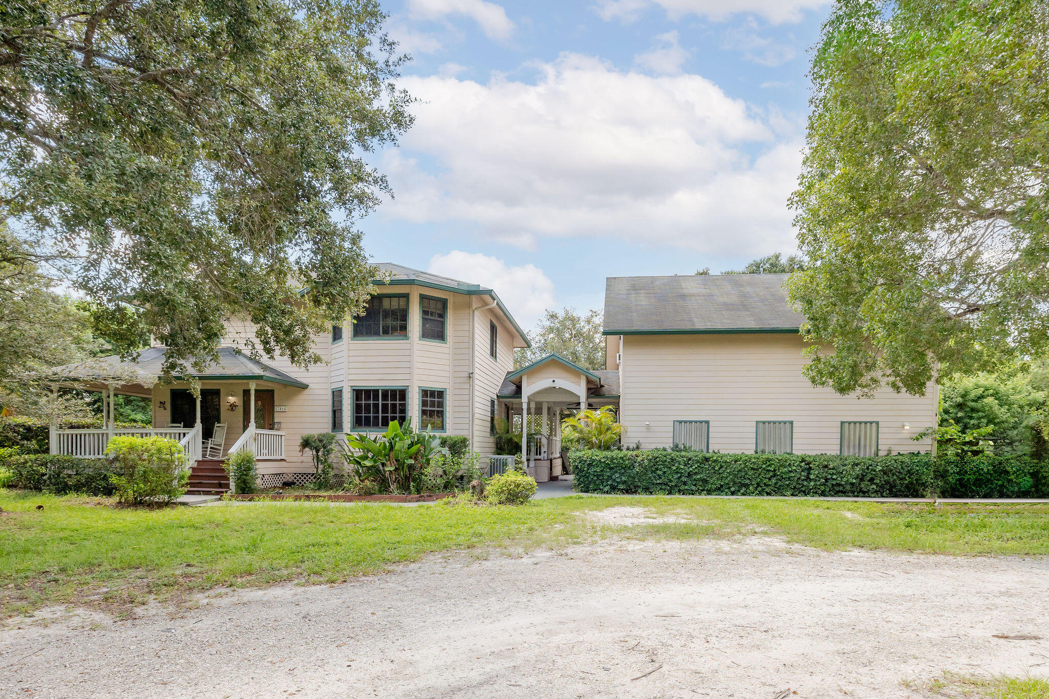 a front view of house with yard and green space