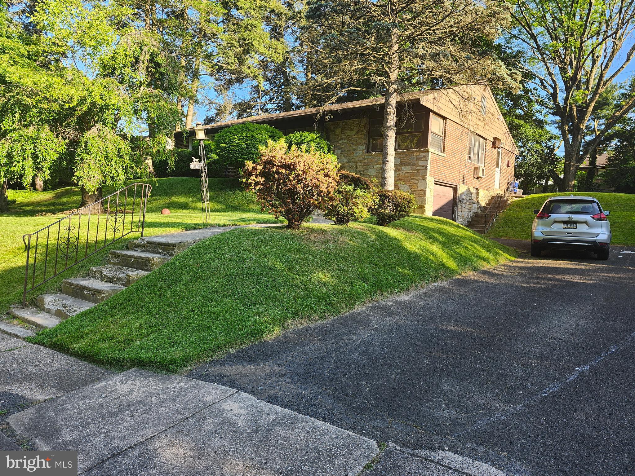 a view of a back yard of the house with a street