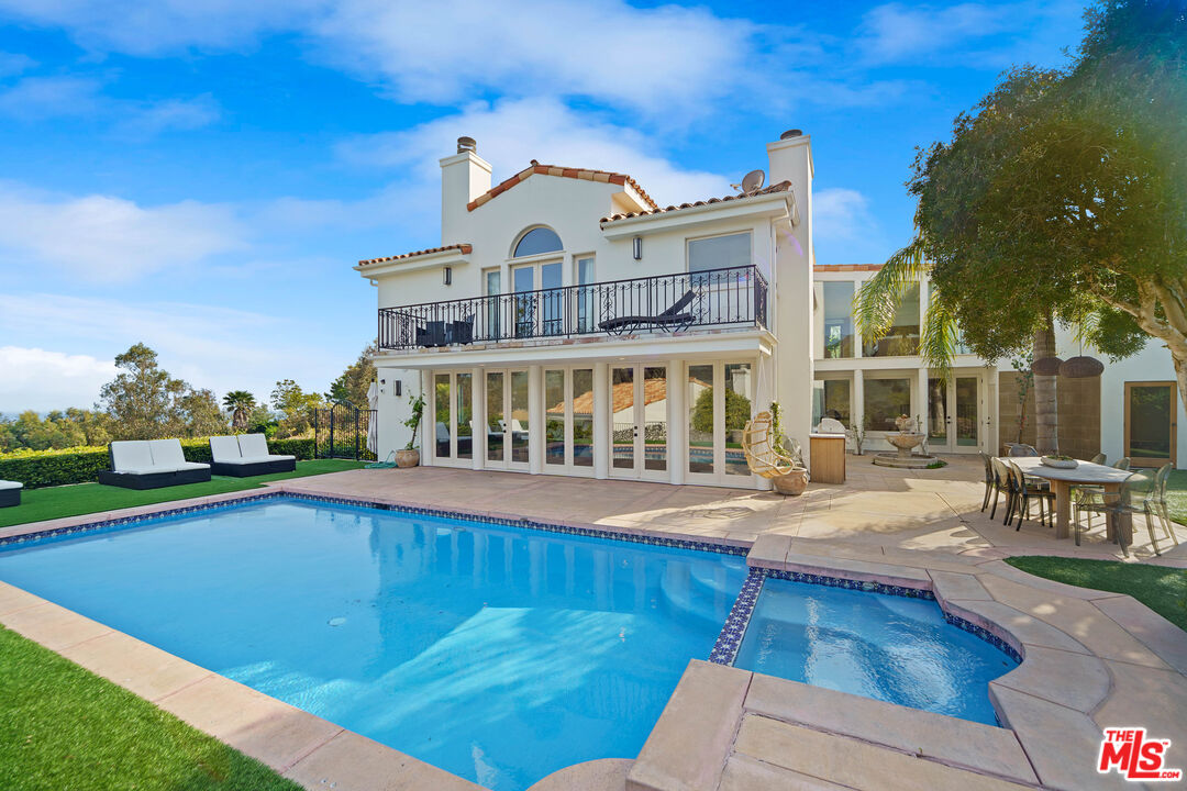 a view of a building with a swimming pool