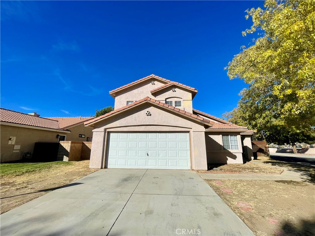 a front view of a house with a garage