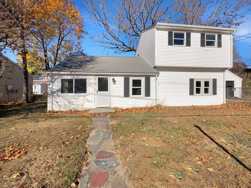 a front view of a house with yard