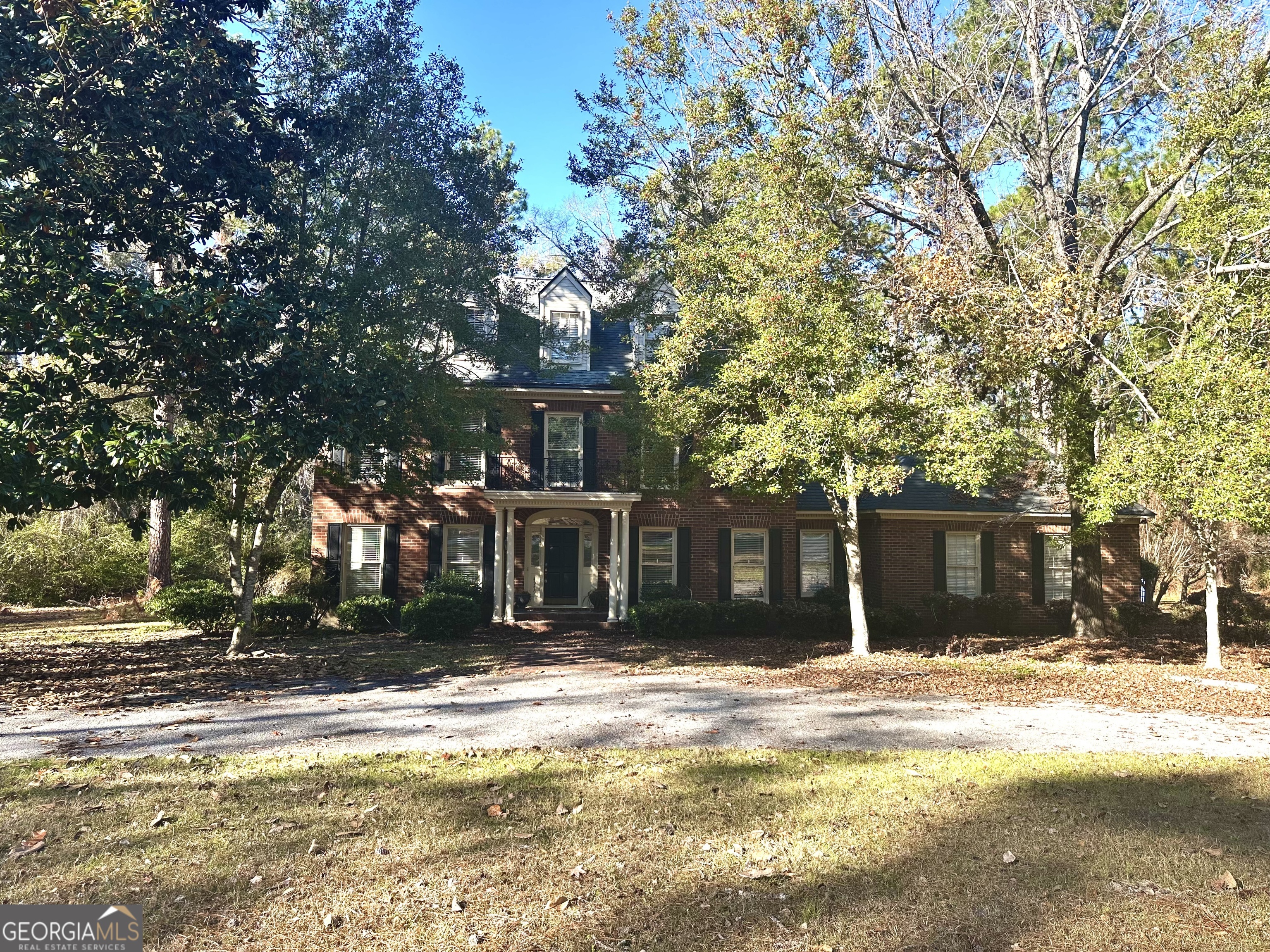 a front view of a house with a ocean view