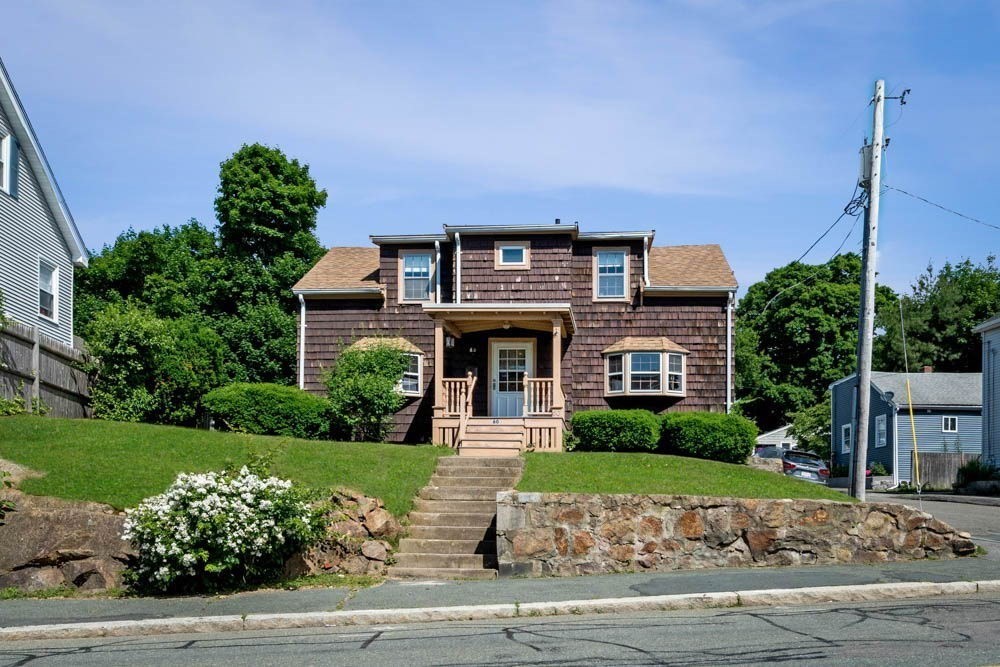 a front view of a house with garden